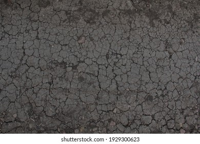 Dirt road with cracks beneath