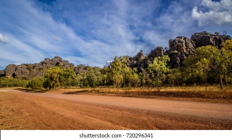 A Dirt Road Through Along Side The Rocks Of Chillagoe