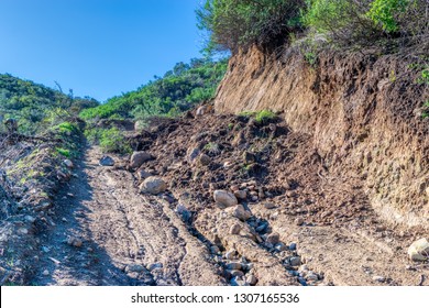 Dirt And Rocks Cover Road From Mud Slide In Forest From Rain Storm