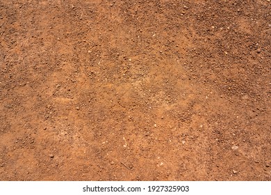 Dirt, terrain or gravel stone road surface pattern in outdoor environmental. Background and textured photo.