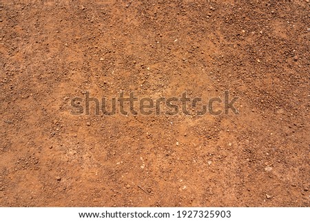 Dirt, terrain or gravel stone road surface pattern in outdoor environmental. Background and textured photo.