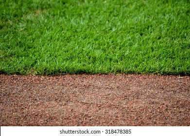 dirt track and grass baseball field landscaping background