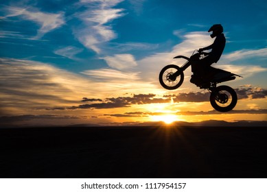 Dirtbike Jumping Durring Sunset 