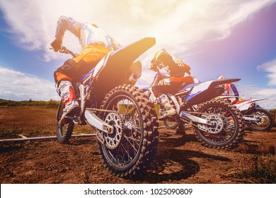 Dirtbike. Team Motocross On Bike Motorcycle Is Start Road.