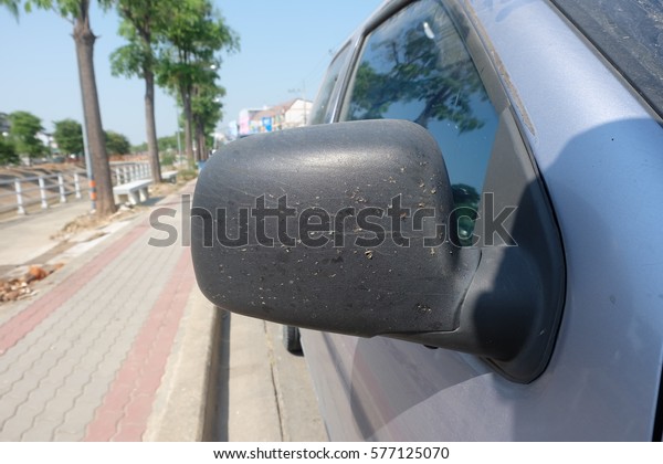 dirtied side mirror of a
car