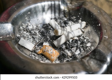 Dirty Ashtray With Cigarette Buts 