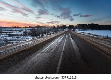 Dirty Asphalt Road With Mix Of Snow, Sand And Salt