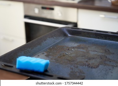 Dirty Baking Sheet.  Dirty Oven Pan On A Kitchen Background