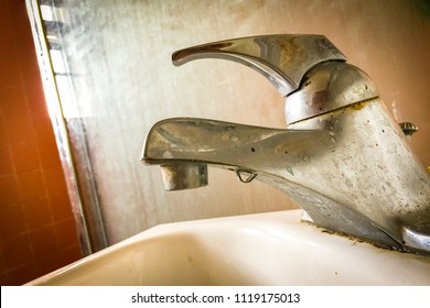 Dirty Bathroom Faucet And Shower Door, Covered In Calcium Deposits And Hard Water Stains.