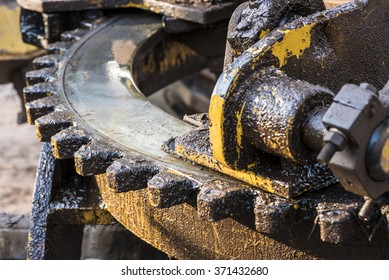 Dirty Big Gearwheel Of Heavy Machinery In Shallow Dept Of Field