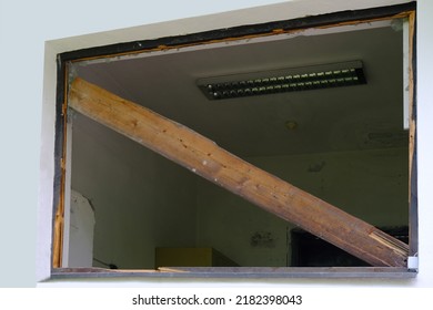 Dirty Broken Window Frame Without Glass, Destroyed House, Concept , Concept Destruction Of Buildings From Explosion, Blast Wave, Collapse Of Business Due To Social Problems, Low-Income Neighborhoods