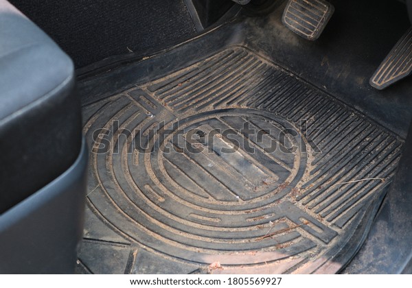 Dirty car floor mats of
black rubber.