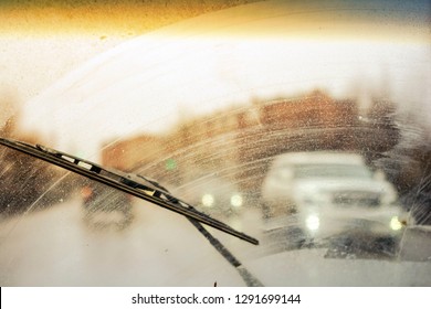 Dirty Car Windshield With The Included Glass Cleaner, In The Big City Front And Back Of The Background Is Blurred