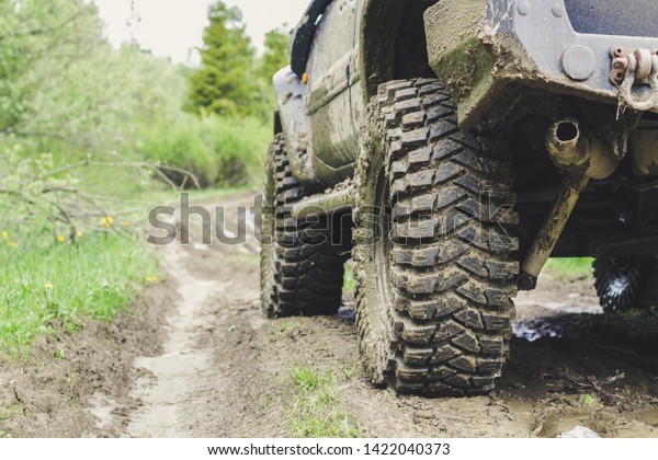 Dirty\
cars and wheels in the mountains. Swamp on the tires. Trips offroad\
across Ukraine. View of the Carpathian\
Mountains.