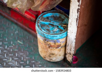 A Dirty Chemical Plastic Box Without MSDS (material Safety Data Sheet) To Describe About Chemical Detail Inside. Hazardous Material In Industrial Object. Selective Focus At Blue Cap's Part.