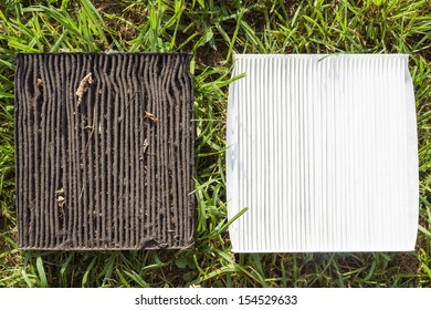 Dirty And Clean Vehicle Air Filters On The Green Grass