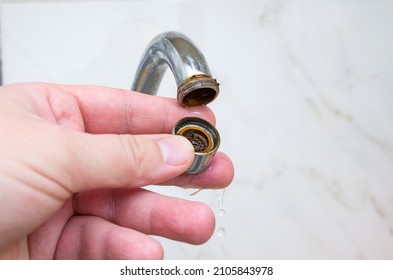 Dirty And Clogged Aerator From Kitchen Sink Faucet. Plumbing Work At Home.