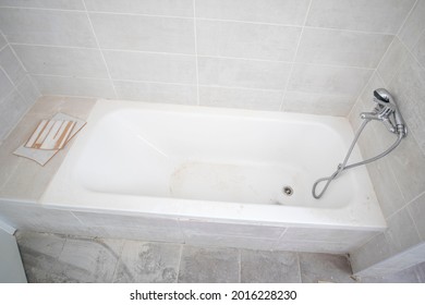 Dirty Clogged Bath Tub During Repair.