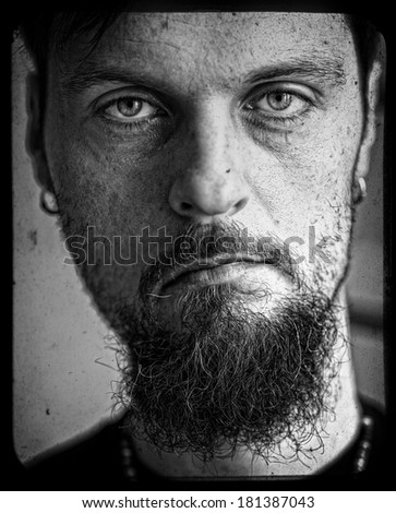 Dirty close up portrait of inscrutable man