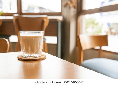 Dirty Coffee Glass On Table In Coffee Shop Cafe