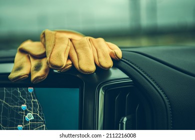 Dirty Construction Worker's Gloves On A Pickup Truck Dashboard. Commercial Vehicle Interior.