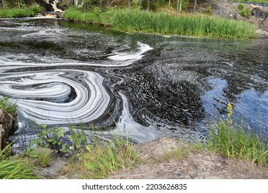 Dirty Contaminated Water In The Lake. Toxic Oily Stain On The Surface Of The Water.