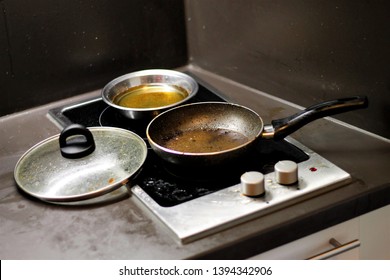 Dirty Cooktop With Oily Pan