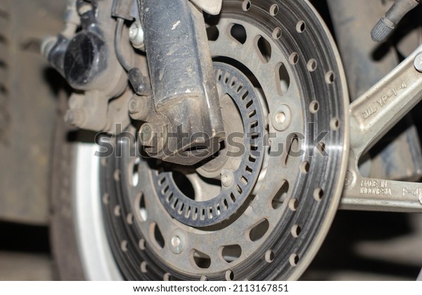 Dirty disc brake\
from motorcycle\
Background
