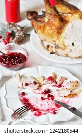 Dirty Dishes In The Christmas After Eating Turkey With Cranberry Sauce. Leftover Food After The Holiday.dirty Dishes After Christmas.