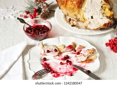 Dirty Dishes In The Christmas After Eating Turkey With Cranberry Sauce. Leftover Food After The Holiday.dirty Dishes After Christmas. Holiday Leftovers