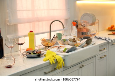 Dirty dishes in kitchen after new year party - Powered by Shutterstock