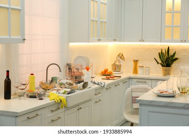 Dirty dishes in kitchen after new year party - Powered by Shutterstock