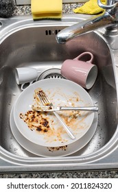 Dirty Dishes In The Kitchen Sink. Food Sauce Stained Porcelain Dishes And Utensils, No People, Top View.