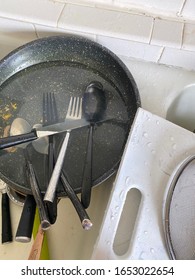 Dirty Dishes In Kitchen Sink Shot From Overhead - Closeup Shot From Overhead - 