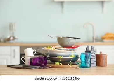 Dirty dishes on kitchen table - Shutterstock ID 1681193506
