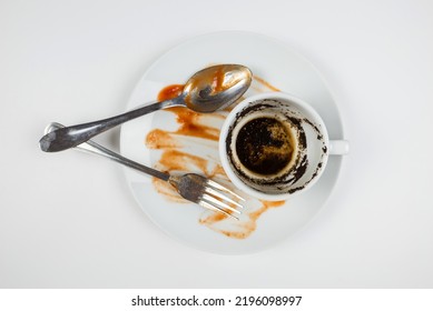 Dirty Dishes On A White Background. Top View Dirty Plate, Cup And Fork With Spoon On White.