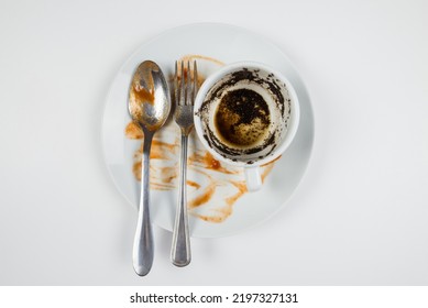 Dirty Dishes On A White Background. Top View Dirty Plate, Cup And Fork With Spoon On White.