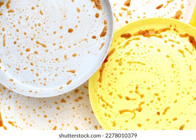 Dirty dishes on yellow background. Top view - Shutterstock ID 2278010379