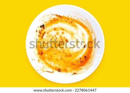 Dirty dishes on yellow background. Top vie