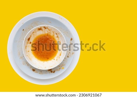 Dirty dishes on yellow background. Top view