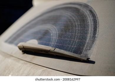 Dirty And Dusty Rear Window Of A White Or Gray Car. Do Not Forget To Wash Your Cars Manually Or At Car Washes