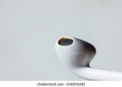 Dirty earbud or earphones clogged with earwax, creating less sound quality and loss of hearing. Earbuds cleaning, health and ear maintenance
 - Shutterstock ID 2143916281