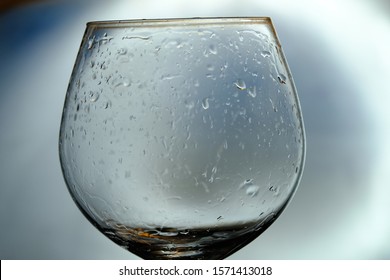 A Dirty Empty Glass Of Wine After The Party