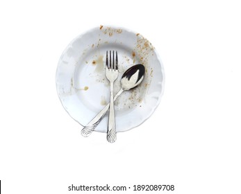 Dirty Empty Plate With Spoon And Fork After Eating. Concept For
Equipment Of Eating Need To Clean. Top View.