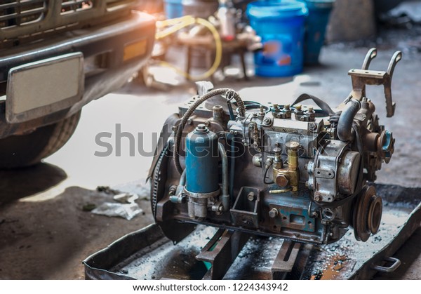 Dirty engine spare parts in
garage