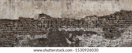 Dirty eroded cracked plaster fence panoramic scene.Destroyed crumbling cement mortar texture. Chipped structure stone facade.Textured overlay uneven surface for 3D loft interior design castle fortress
