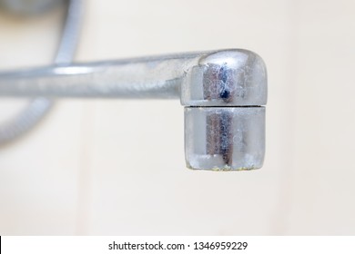 Dirty Faucet Aerator With Limescale, Calcified Shower Water Tap With Lime Scale In Bathroom, Close Up.