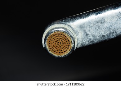 Dirty Faucet Aerator With Limescale, Calcified Shower Water Tap With Lime Scale On Dark Background In Bathroom, Close Up