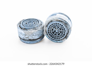 Dirty faucet aerator with limescale, calcified shower water tap with lime scale in bathroom, close up, isolated on white