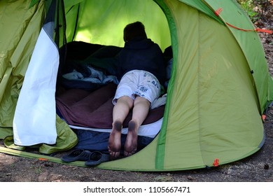 Dirty Feet Of A Child In A Tent